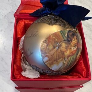 Elegant Sorelle Gold Holiday Ornament with Blue Ribbon